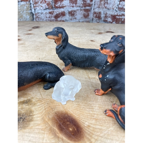 214 - Four Dachshund Figures