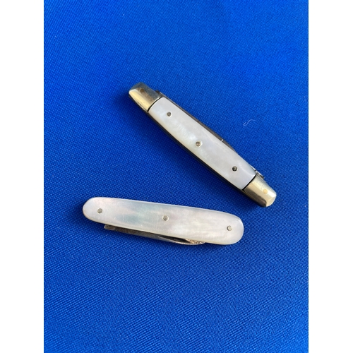 242 - Two Mother Of Pearl Pen Knives. One Having Hallmarked Silver Blade.