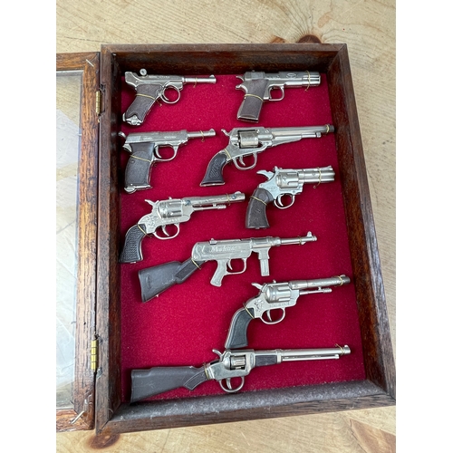 195 - Display Case Of Miniature Replica Guns