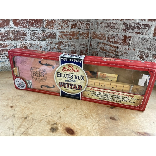 334 - Electric Blues Box Slide Guitar Boxed With Instructions.