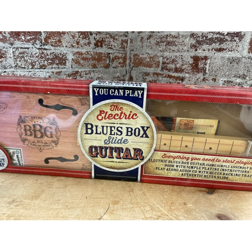 334 - Electric Blues Box Slide Guitar Boxed With Instructions.