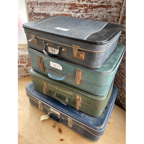 123 - Four Vintage Suitcases