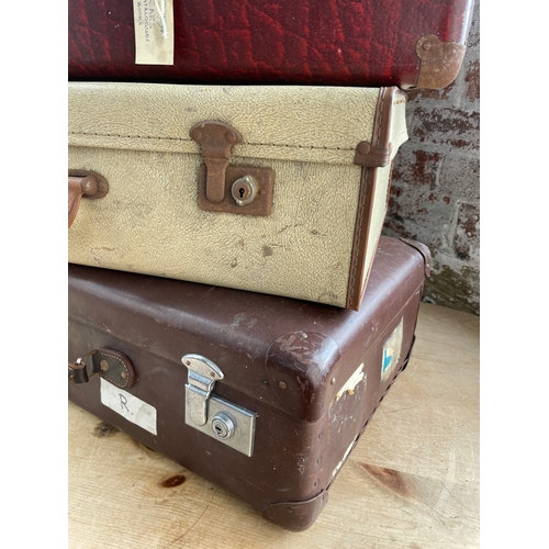 124 - Four Vintage Suitcases