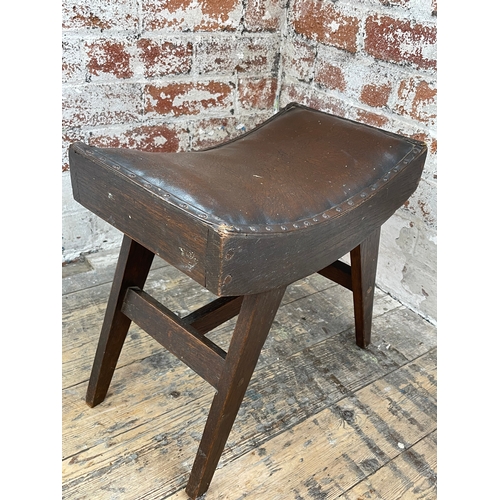 519 - Vintage Leather Saddle Shape Stool