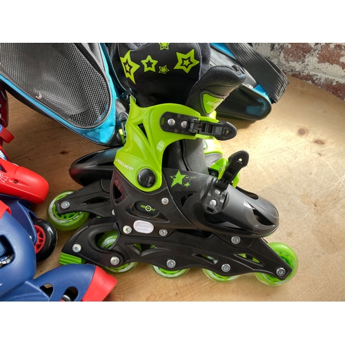 421 - Two Pairs Of Adjustable Inline Roller Skates With Carry Bags