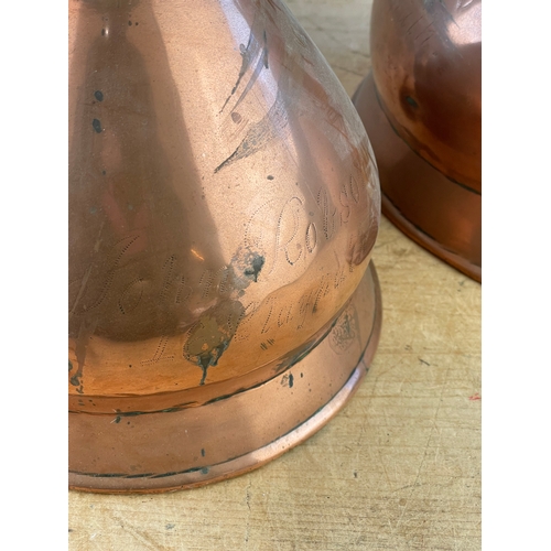 141 - Two Large Antique Copper Measuring Jugs