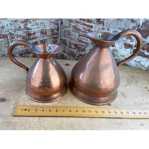 141 - Two Large Antique Copper Measuring Jugs