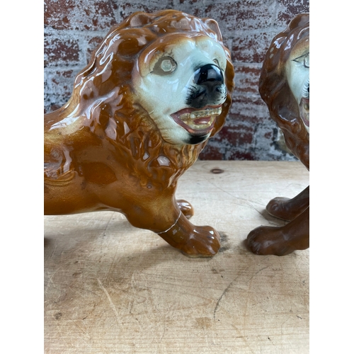 211 - Pair Of Antique Staffordshire Lions. 1 a/f