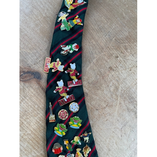 110 - Large Quantity Of Pin Badges Mounted On A Tie