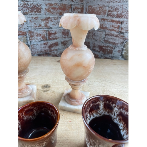 58 - Two Alabaster Urns & Three Items Of Treacle Glaze Pottery By Kernewek Potteery.