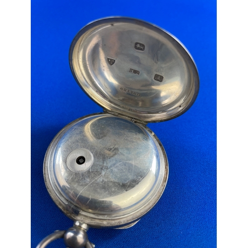 46 - 1901 Silver Pocket Watch With Ornate Metal Face. Ticks for a few seconds before sticking.