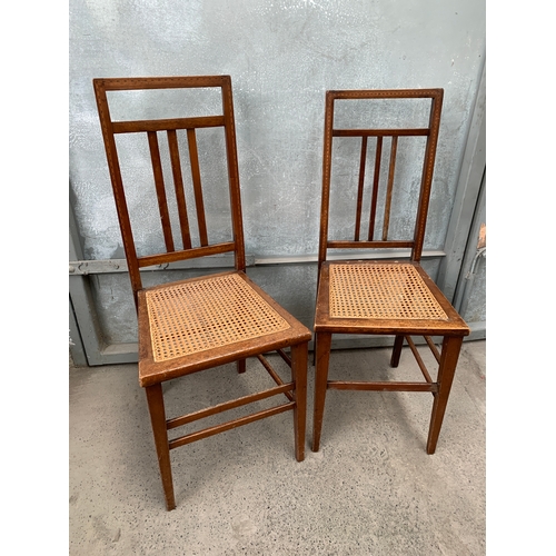 381 - Two Arts and Crafts Cane Chairs with Inlaid Marquetry Design