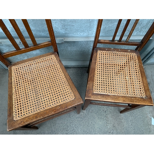 381 - Two Arts and Crafts Cane Chairs with Inlaid Marquetry Design