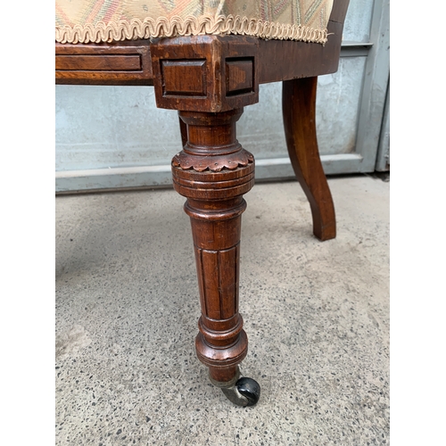 435 - Antique Chair with Castors to the Front Legs and Carving