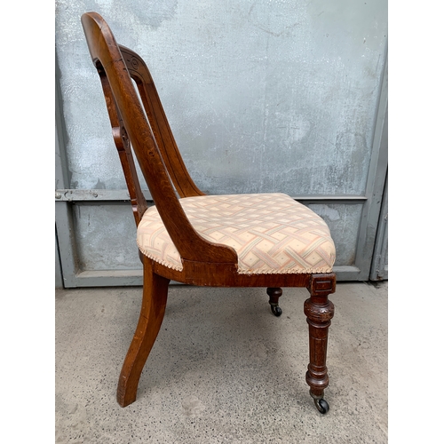 435 - Antique Chair with Castors to the Front Legs and Carving