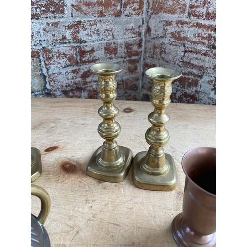 257 - Brass Candlesticks & Copper Item Inc. Good Quality Jug. Previously Owned By The Sugden Family Of Woo... 