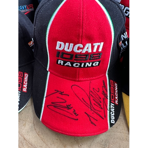 428 - 27 Baseball Caps Inc. Two Signed Ducatti Racing