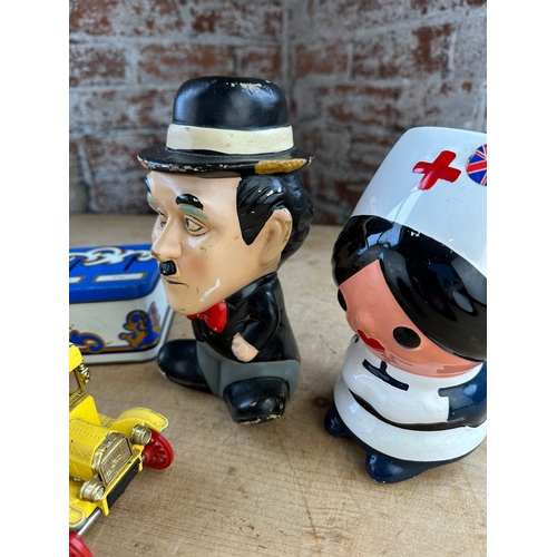 133 - Vintage Money Boxes Inc. Toymaster & Charlie Chaplin.