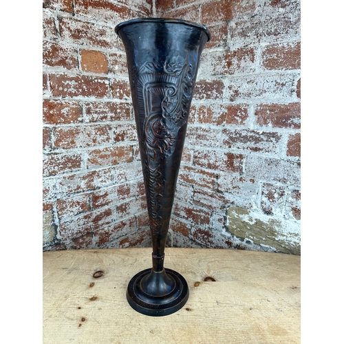 217 - Tall Metal Fluted Vase with Repousse Decoration.