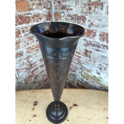 217 - Tall Metal Fluted Vase with Repousse Decoration.