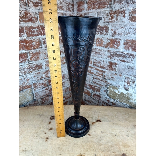 217 - Tall Metal Fluted Vase with Repousse Decoration.