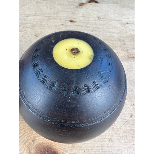 225 - Two Lignum Vitae Lawn Bowls