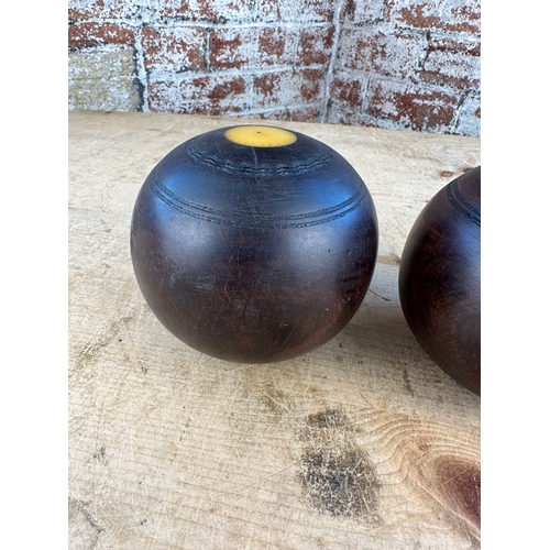 225 - Two Lignum Vitae Lawn Bowls