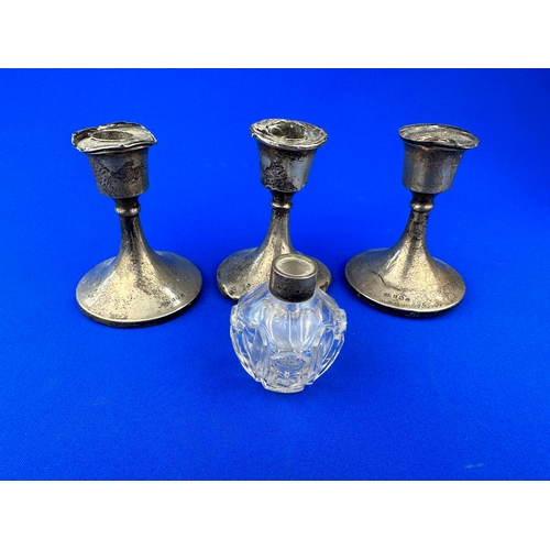 7 - Three Scrap Silver Candle Holders & Silver Topped Cut Glass Scent Botlle missing stopper.