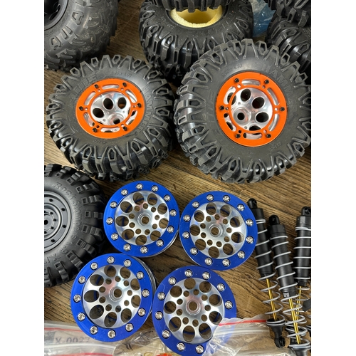 89 - Large Amount of Radio Control and RC Rock Crawler Spares inc Bead Lock Wheels, Tyres, Batteries, Spe... 