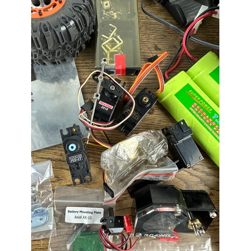 89 - Large Amount of Radio Control and RC Rock Crawler Spares inc Bead Lock Wheels, Tyres, Batteries, Spe... 