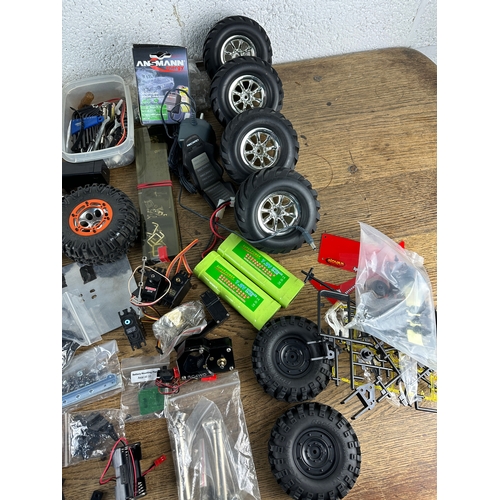 89 - Large Amount of Radio Control and RC Rock Crawler Spares inc Bead Lock Wheels, Tyres, Batteries, Spe... 