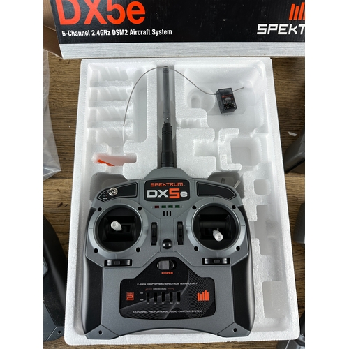 100 - Two Spektrum DX5e 5 Channel Radio Controllers (Boxed one seems unused) Spektrum DX3 and Traxxas Radi... 