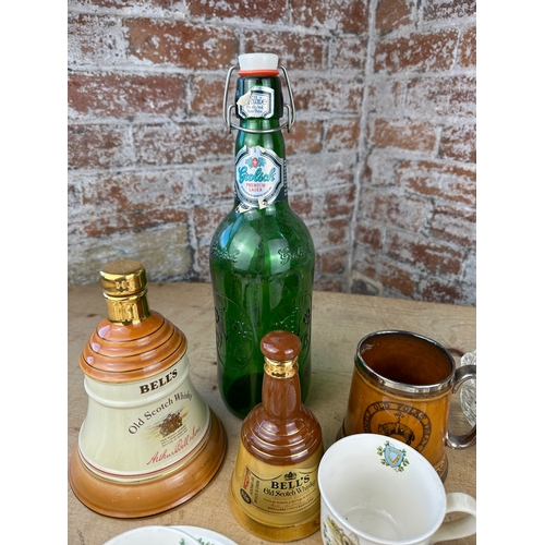 370 - Box of Collectables inc. Wade Bells Whiskey Decanters, 1.5l Grolsch Bottle, Suir Souvenir Cups & Sau... 