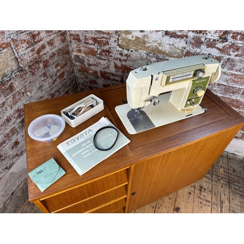 400 - Mid Century Type Cabinet with Toyota Sewing Machine and Spares and Accessories