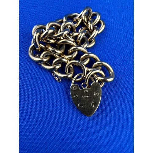 19 - 9CT Gold Curb Link Bracelet with Heart Shape Locket 18.4g 18cm Long