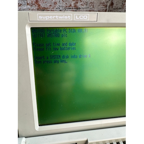 319 - Vintage Amstrad PPC512 Portable Personal Computer. Boots Up, Needs Disk,Not PAT Tested.