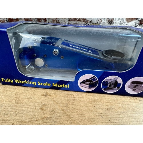 154 - Michelin Fully Working Scale Model Racing Jack. Boxed as new.