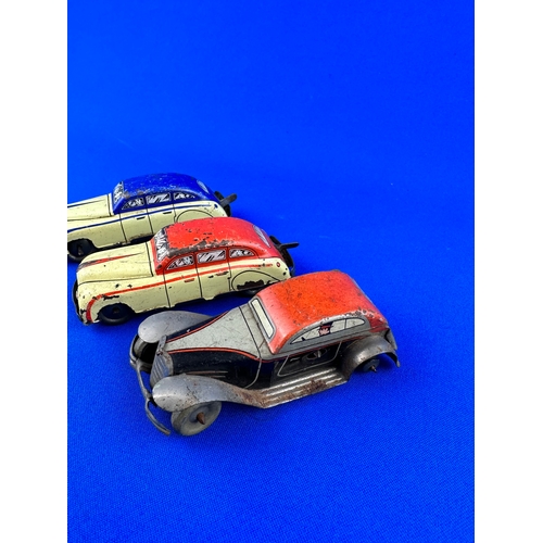 67 - Three Vintage Tin Plate Toy Cars