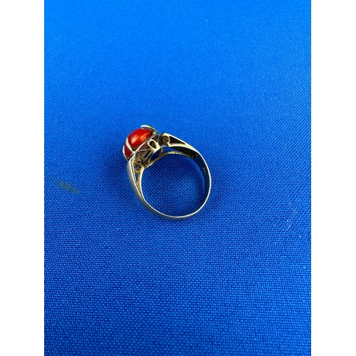 38 - Gold & Red Coral Ring size L 3.63g groos. Marked 18K tested as high carat gold.