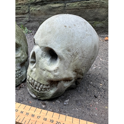 349 - Two Cast Concrete Skulls