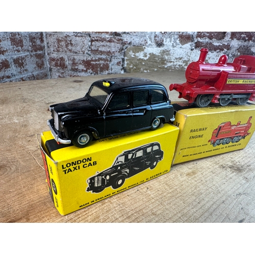 321 - Two Boxed Budgie Diecast Vehicles - London Black Cab & Train