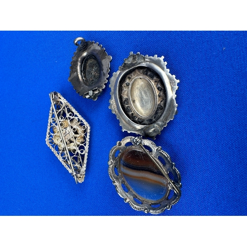 8 - Four Silver Brooches