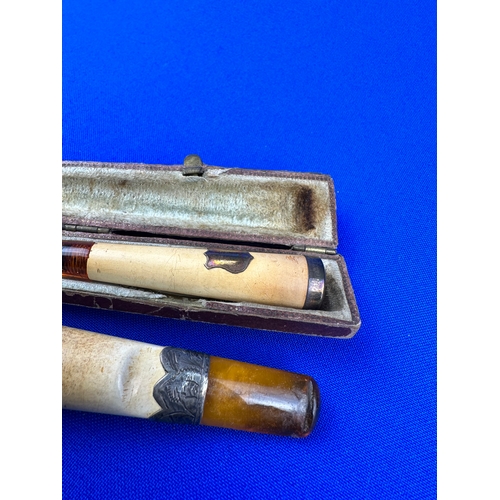 104 - Two Amber Cheroot Holders