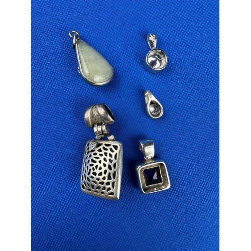 18 - Five Silver Pendants