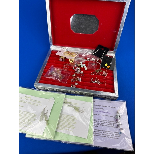 94 - Quantity of Earrings in White Metal Horse Design Box