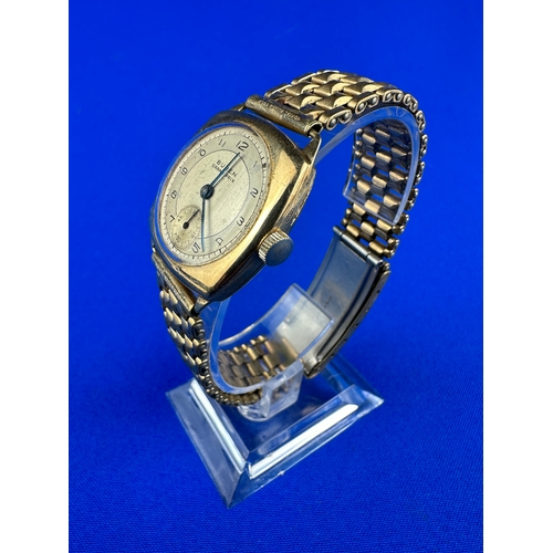 73 - 9ct Buren Grand Prix Wristwatch - Wporking. over 9g of 9ct in Case, Nice Rolled Gold Strap.