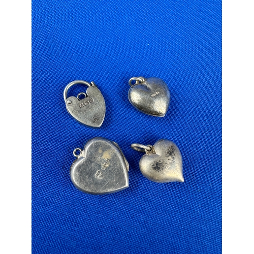 53 - Four Silver Heart Shape Pendants