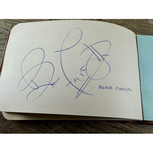 263 - Autograph Book and Postcards to include - Roger Moore, Chris Barber, Bruce Forsyth, Ray Reardon, Ber... 