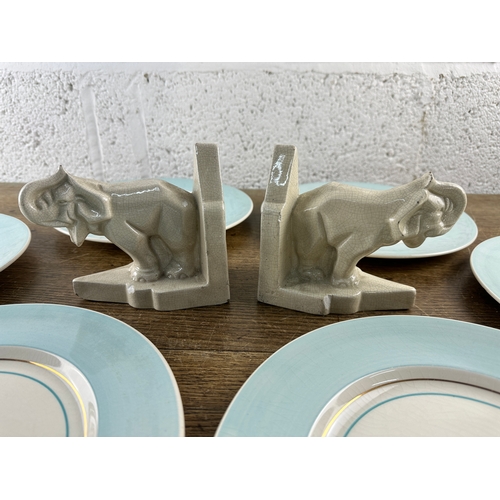 189 - Six Clarice Cliff Plates and Two Antique Ceramic Elephant Bookends