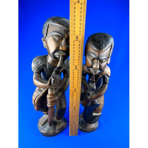 301 - Two Carved Wooden Figures approximately 50cm tall.